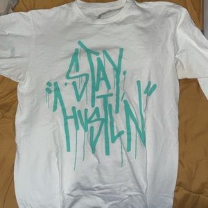 Stylish “Stay Hustlin” tee price is negotiable.